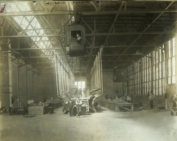 Workers pose in the plumbing room of the "malleable shop" at Osborne Works. The factory was later known as "Auburn Works."