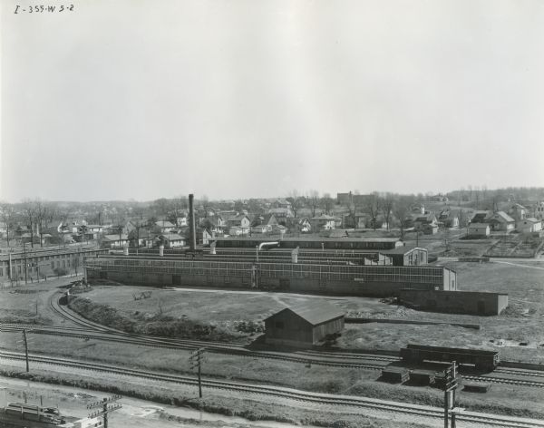 Elevated view of International Harvester's Springfield Works (factory) with railroad tracks in the foreground.