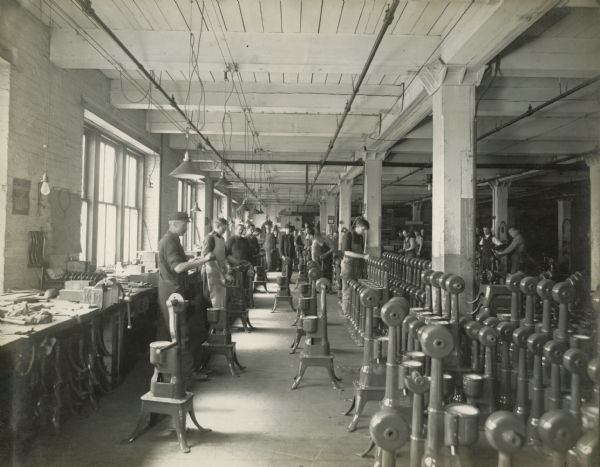 Factory workers assemble cream separators at International Harvester's Milwaukee Works.