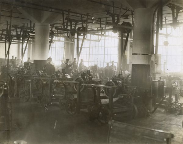 Factory workers at their machines at International Harvester's Akron Works.