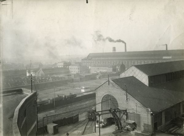 Elevated view of the buildings of International Harvester's Croix Works (factory) and the accompanying transport railway. Croix was located in France.
