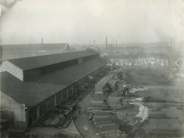 Elevated view of the lumberyard and railway at International Harvester's Croix Works in France.