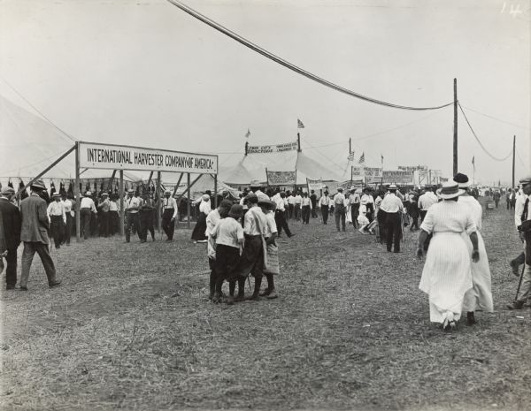 Crowds gather around the International Harvester Company of America and Minneapolis Steel and Machinery Company tents at the Fremont Tractor Show.