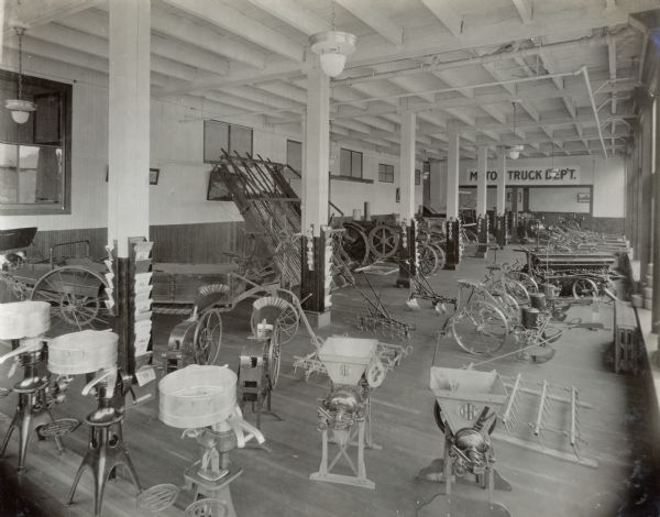 Cream separators, feed grinders, corn shellers, tractors and other farm machines on a showroom floor in the International Harvester Branch House.