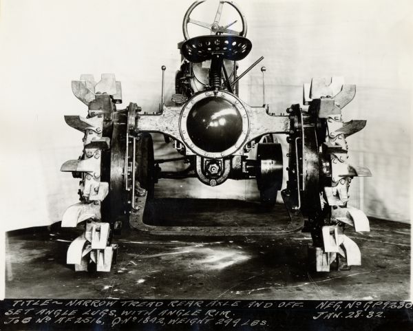 Engineering photograph of a Farmall tractor with "narrow tread rear axle and off-set angle lugs, with angle rim."