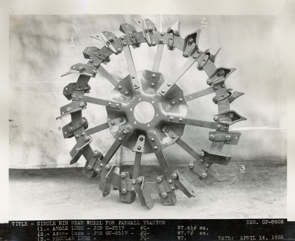 Engineering photograph of a "single rim rear wheel for Farmall tractor."