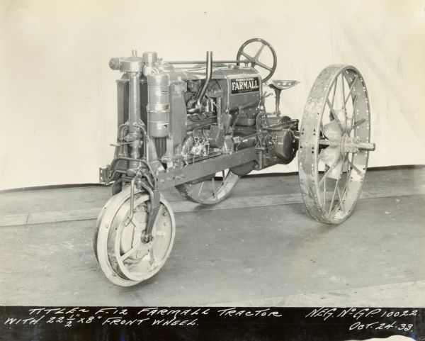 Engineering photograph of a Farmall F-12 tractor with a single 22 1/2" x 8" front wheel.