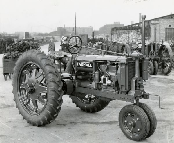 Farmall F-14 tractor with rubber (pneumatic) tires outside an International Harvester factory.
