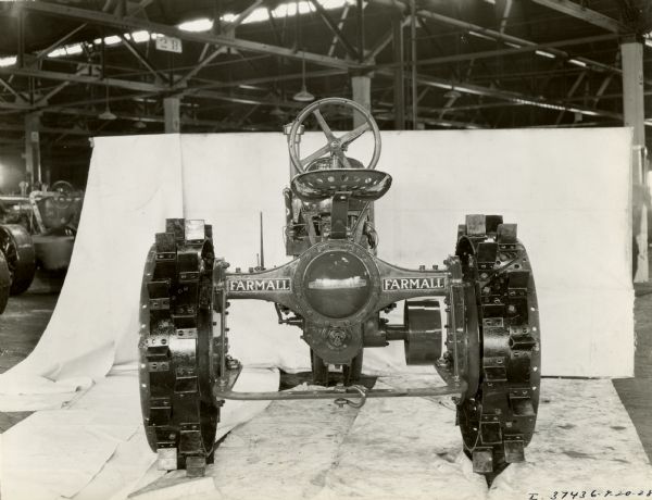 Engineering photograph of rear view of a Farmall Regular tractor. The photograph shows details including decals, and was likely taken at an International Harvester factory.