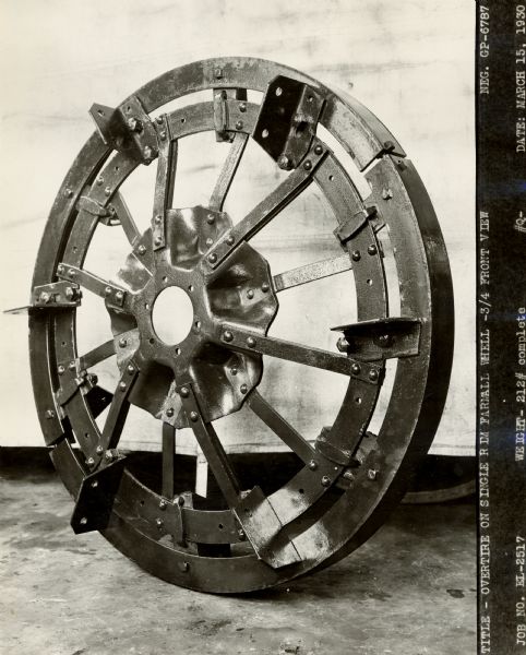 Engineering photograph of an "overtire on single rim Farmall wheel".
