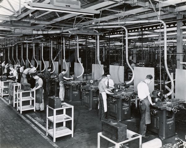 Factory workers at their stations at International Harvester's Chatham Works in Ontario, Canada.