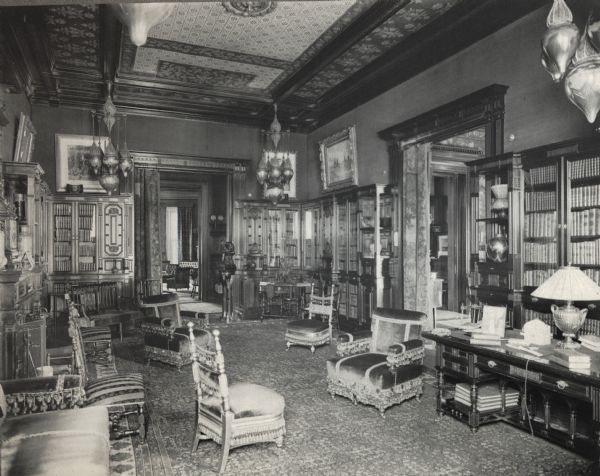 Ornately decorated library at 675 Rush Street. The house was built for Cyrus Hall McCormick and his family in 1879. After McCormick's death in 1884, the house was occupied by his widow Nettie Fowler McCormick. The photograph is taken from a photograph album entitled: "The Old Home".