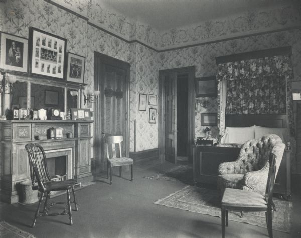 Bedroom at the McCormick residence on Rush Street. From photograph album entitled, "Rockbridge Place, The Old Home" and inscribed with the name M. Virginia McCormick. A handwritten caption describes the image as "Virginia's Room". The house was built for Cyrus Hall McCormick and his family in 1879. After McCormick's death in 1884, the house was occupied by his widow Nettie Fowler McCormick.