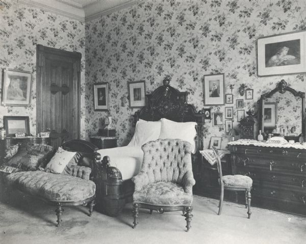 Bedroom at the McCormick family residence on Rush Street. The house was built for Cyrus Hall McCormick and his family in 1879. After McCormick's death in 1884, the house was occupied by his widow Nettie Fowler McCormick. The photograph is taken from a photograph album entitled "The Old Home".
