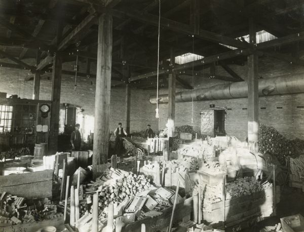 Men at work in the malleable castings room of the St. Paul Flax and Twine Mill.