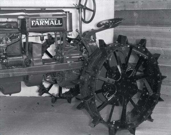 Engineering photograph of the left rear section of a Farmall tractor.