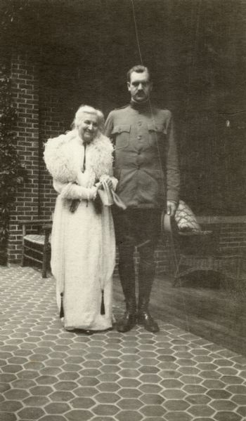 Lieutenant Cyrus McCormick III (1890-1970), in uniform, poses with his grandmother Nettie Fowler McCormick (1835-1923) at Walden, the Lake Forest estate of his father, Cyrus McCormick Jr.