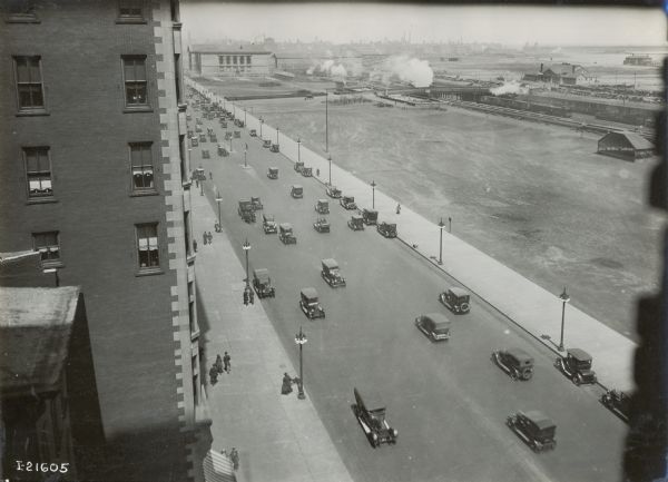 Elevated view of Grant Park and cars on the adjacent street taken from the International Harvester offices.
