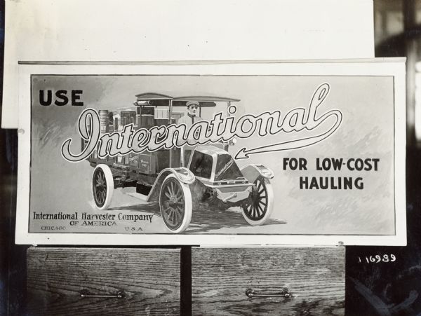 Close-up view of an International Harvester Company truck advertisement.