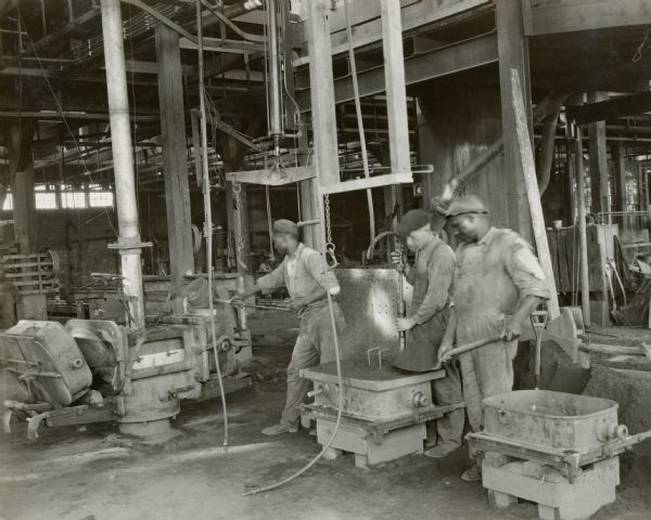 Three factory workers at the Chattanooga Plow Works.