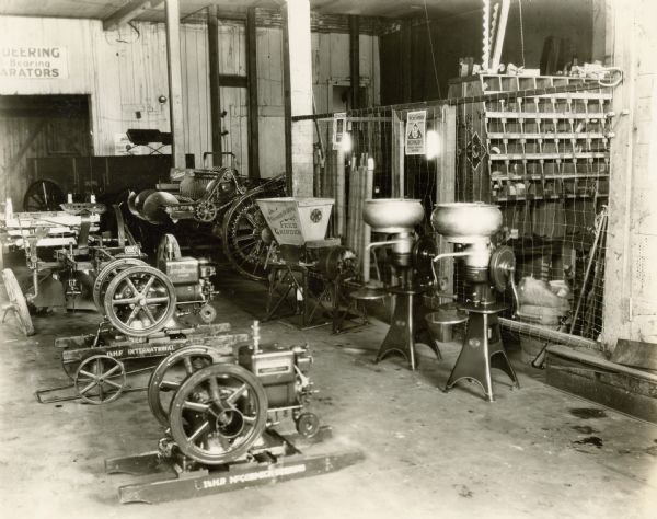 International Harvester engines, McCormick-Deering feed grinders, and cream separators lined up inside the Colfax Co. Implement Company, an International Harvester dealership.