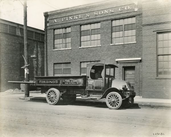 A. Finkl & Sons Co. International Model "L-101" truck in front of the company building.