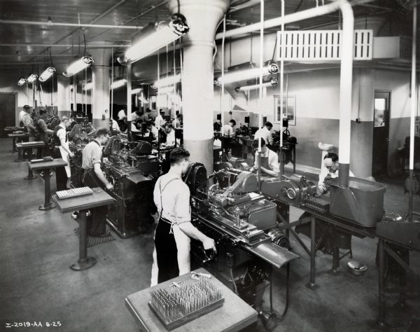 Factory workers run machines in the Diesel [Engine] Machine Shop at Milwaukee Works.