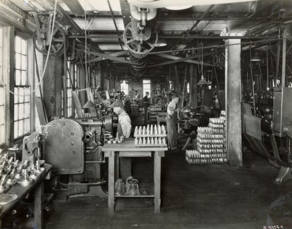 Factory workers and parts at Milwaukee Works.