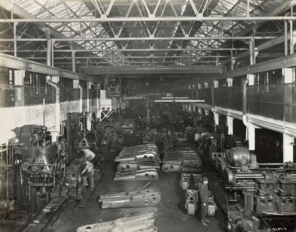 Elevated view of a large factory room with workers and parts at Milwaukee Works.