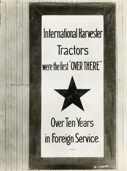 International Harvester war advertisement with a large star in the center that reads: "International Harvester Tractors were the first 'OVER THERE' Over Ten Years in Foreign Service."