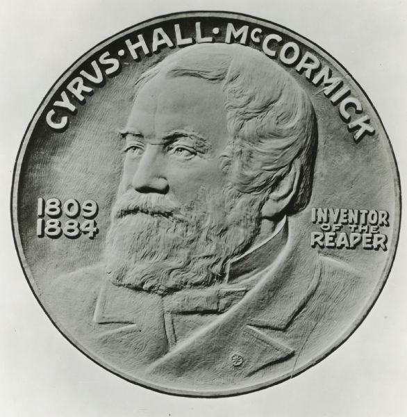 Front side of International Harvester's reaper centennial medallion (or coin), featuring an image of Cyrus Hall McCormick, the words: "Inventor of the Reape,," and his years of birth and death, 1809 and 1884.