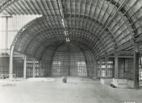 Interior view of the partially completed International Harvester exhibit building for the "A Century of Progress" world's fair in Chicago.