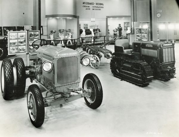 A McCormick-Deering industrial tractor and a TracTracTor (crawler tractor) on display in the International Harvester exhibit at the "A Century of Progress" world's fair. A cream separator and milker display is in the background.
