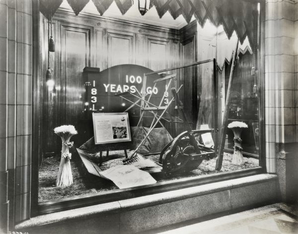 Display in the window of the Hudson Bay Company department store in Alberta, Canada, celebrating the centennial anniversary of the reaper's invention.