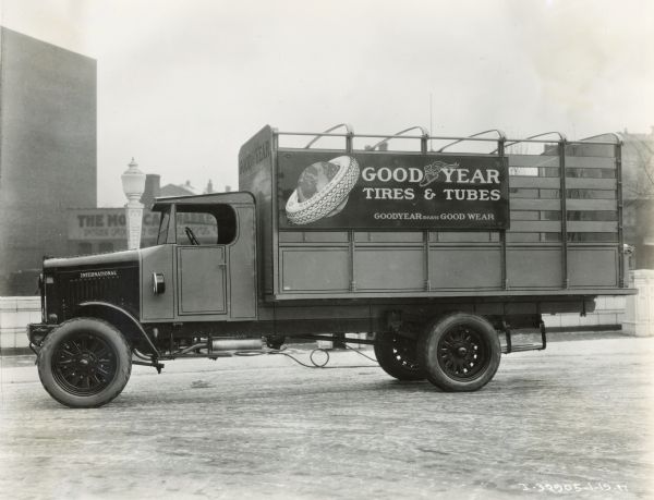 International Model 63 truck operated by the Goodyear Company. The sign on the truck reads: "Goodyear Tires & Tubes; Goodyear means Good Wear".