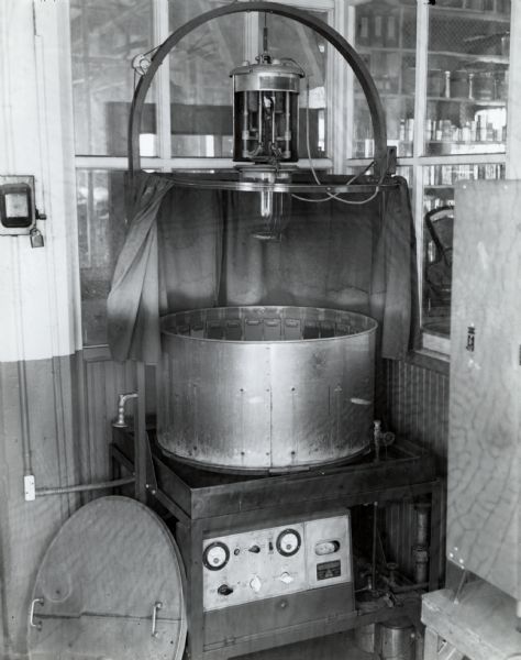Accelerated weather testing machine used to test the durability of paint in the McCormick Works (factory) Paint Department.