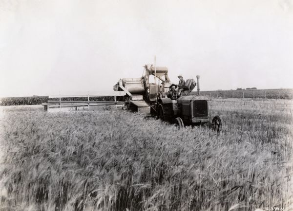 A J-30 tractor with a No. 11 Deering harvester-thresher (combine) on the farm of Dr. Juan Balbi in the Argentine Republic in South America.