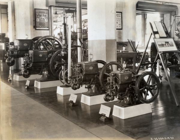 Stationary engines lined up in a showroom at McCormick Works.