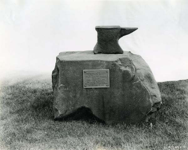 Anvil and anvil stone with a plaque stating: "Anvil and Anvil Stone similar to ones used by Cyrus Hall McCormick in making the First Reaper on Walnut Grove Farm near Steele's Tavern Virginia in the Year of 1831."