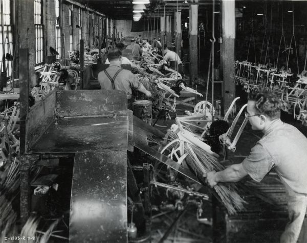 Factory workers test binder knotters at the McCormick Works.