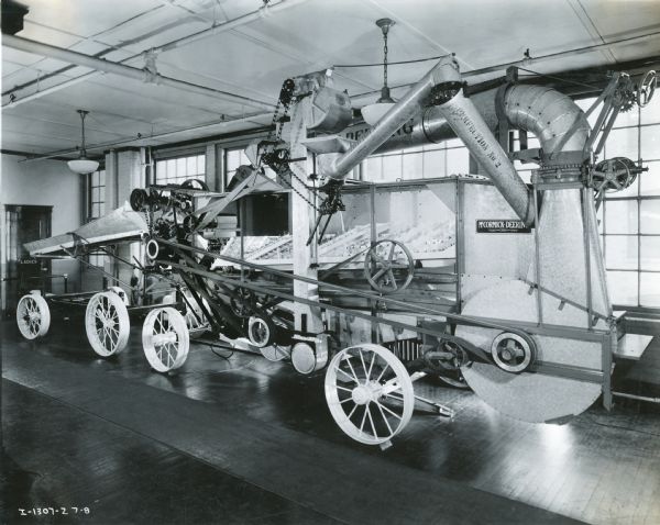 A McCormick-Deering all-steel thresher modified for display at the McCormick Works factory showroom.