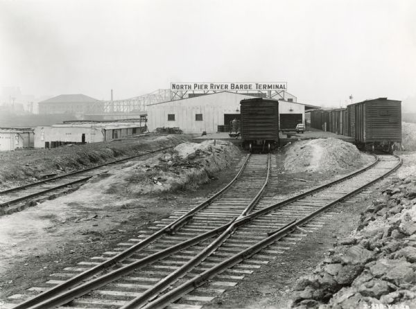 Railroad cars and tracks at the North Pier River Barge Terminal at or near the McCormick Works (factory).