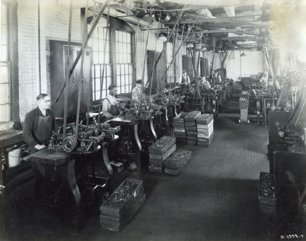 Factory workers at machines in the McCormick Works.