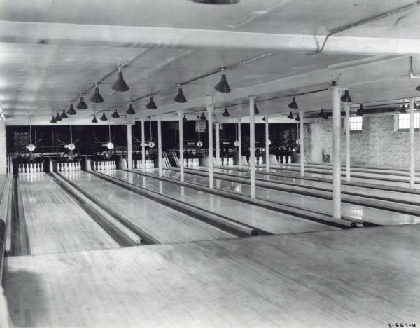Interior view of bowling alley lanes at the McCormick Works Club House. The Club House was designed for recreational use by factory employees.