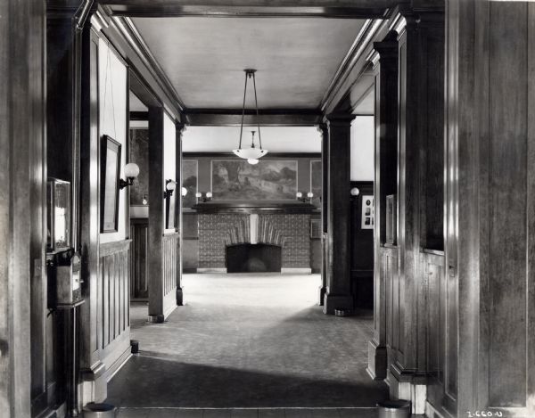 Hallway leading to a fireplace in the McCormick Works Club House. The Club House was designed for recreational use by factory employees.