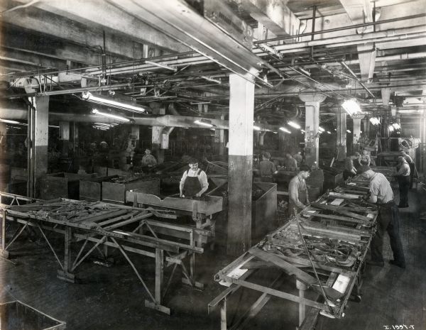 Factory workers assembling machines at the McCormick Works.