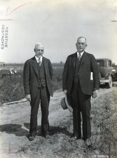 Dr. Butler, editor of the <i>Progressive Farmer</i>, and W.C. Mauley, manager of International Harvester's Memphis branch, stand together for a portrait on a dirt road.