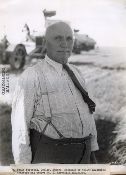 Mr. Louis Bertrand, operator of twelve McCormick tractors and twelve No. 11 harvester-threshers, poses for a photograph.