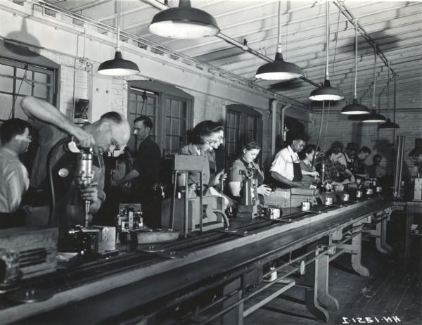 Factory workers work on an assembly line at West Pullman Works.