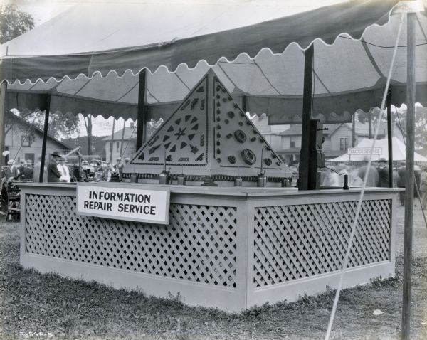 International Harvester's "Information and Repair Service" booth stands at the Indiana State Fair.